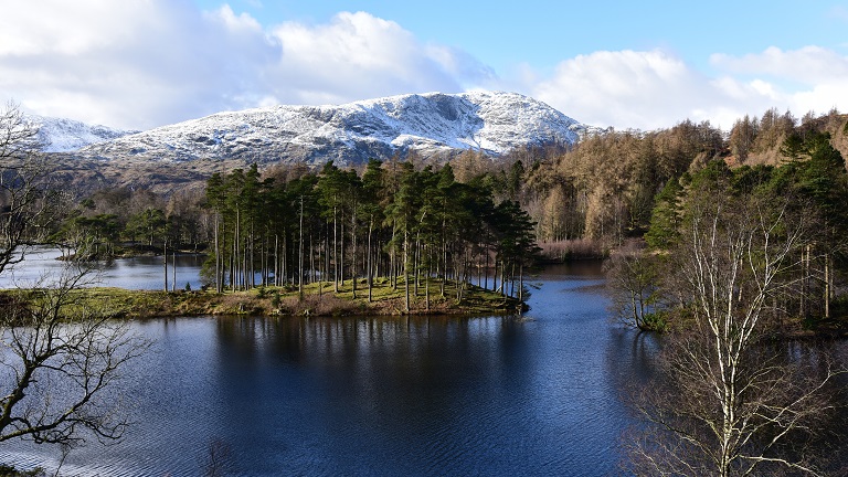 Tarn Hows, which is home to an unbelievably pretty lake surrounded by trees and mountains and circumnavigated by a pleasant circular walking trail